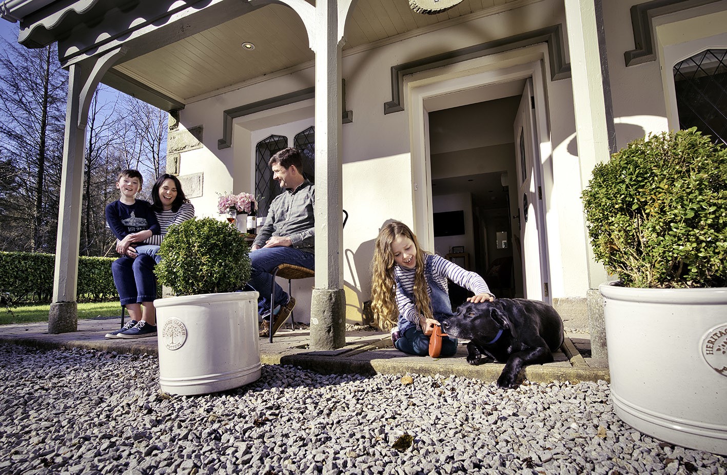 family at pet-friendly Gate Lodge with dog