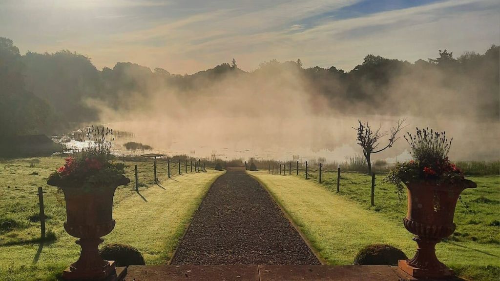 Misty morning over lake at Blessingbourne